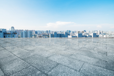 cityscape and skyline of hangzhou from empty brick floorの写真素材