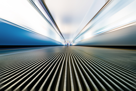 Moving walkway and light on background.の写真素材