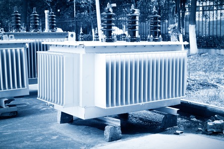 High voltage transformer with electrical insulation and electrical equipment in power substation.