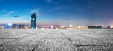 modern buildings near shanghai at night from empty floorの写真素材
