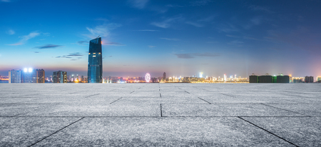 modern buildings near shanghai at night from empty floorの写真素材