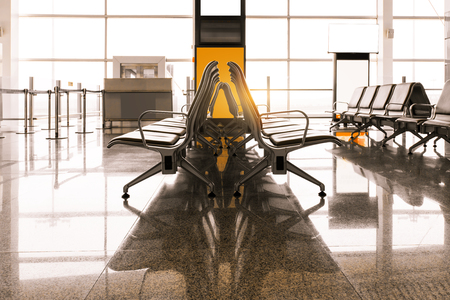 Empty airport terminal waiting area with chairsのeditorial素材
