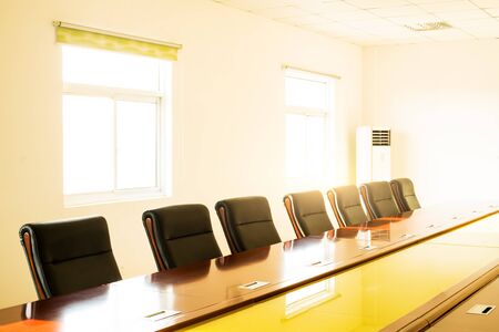 Modern conference room with furniture, laptops, big windows and city view 3D Render