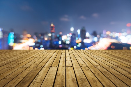 Aerial photography bird view at Empty road floor surface with city landmark buildings background at Shanghai Skyline of night sceneの写真素材