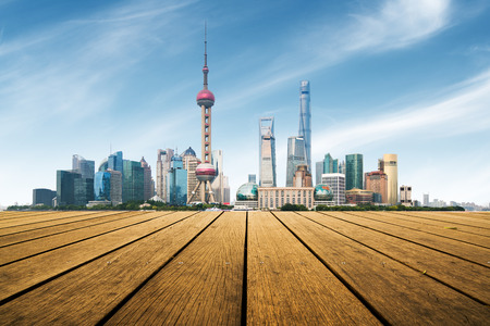 Empty square floor and with cityscape and skyline at sunset in Shanghai,China
