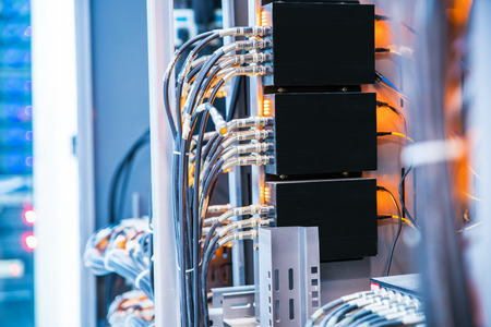 network cables connected to a switch and patch-panel,internet concept background,symbol of global...