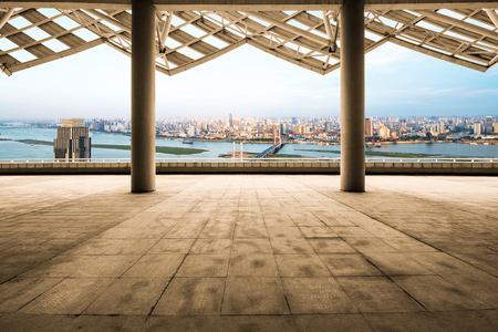 cityscape of modern city at dawn from empty floorの写真素材