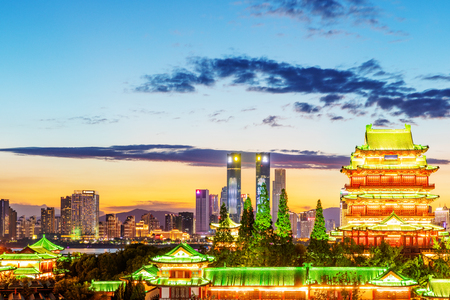 The combination of urban architecture and old architecture in Nanchang, China (the Chinese character in the ancient building is Tengwang Pavilion)の写真素材
