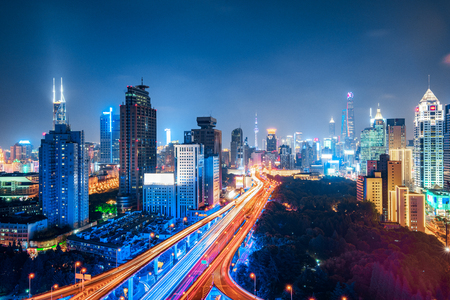 shanghai elevated road junction and interchange overpass at nightの写真素材