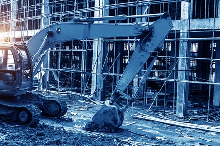 excavator at sandpit during earthmoving worksの写真素材