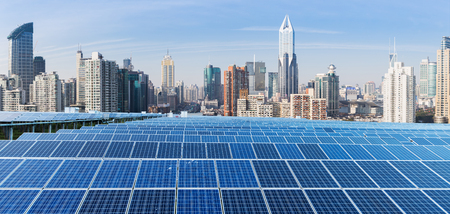 Solar panels and urban construction backgroundの写真素材