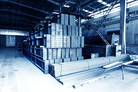 The interior of a big industrial building or factory with steel constructionsの写真素材