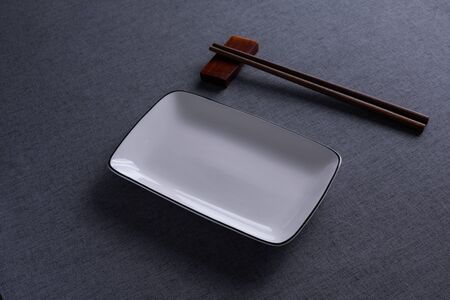 Ceramic dishes and chopsticks on the table