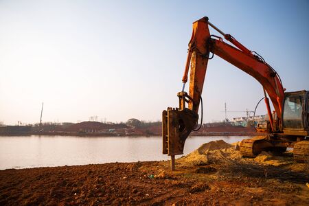 Big excavator in construction siteの写真素材