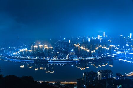 Skyscrapers reflecting in the riverの写真素材