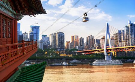 cityscape and skyline of downtown near water of chongqing at nightの写真素材