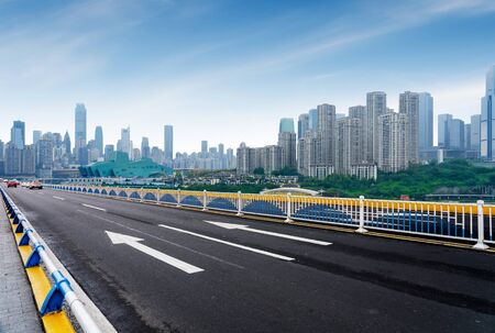 Expressway in front of the city skyline, Chongqing, China.の写真素材