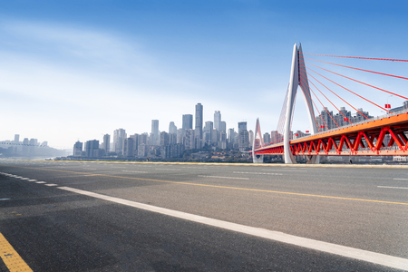 Expressway in front of the city skyline, Chongqing, China.のeditorial素材