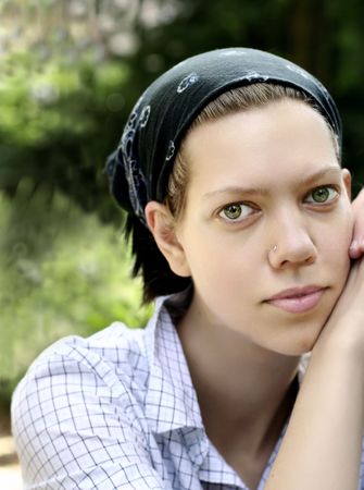 Young woman portrait with head scarfの写真素材
