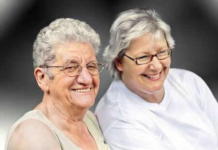 Senior woman portrait, on  grey background with white hair の写真素材