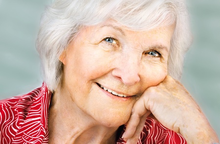  Senior woman portrait, closeup, hand on chin,smiling graciously