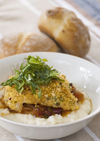 Plated fish with dinner rollsの写真素材