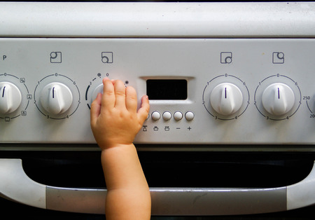 Children's hand and cookerの写真素材