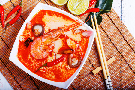 Thai Tom Yam soup with shrimp and shiitake mushrooms, served with limeの写真素材