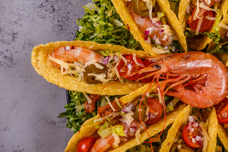 Tacos with shrimp, lettuce, cheese and jalapeno, top view.の写真素材