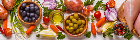 Chicken breast with fresh vegetables and spices for cooking. Healthy or diet food concept.の写真素材