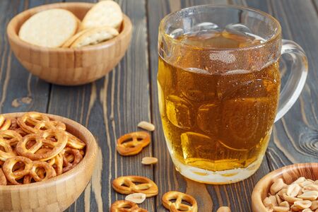 Beer with Pretzels, Crackers and Nuts, selective focus.の写真素材