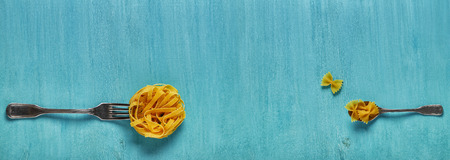 Concept of food, pasta on a blue background, top view, banner.の写真素材
