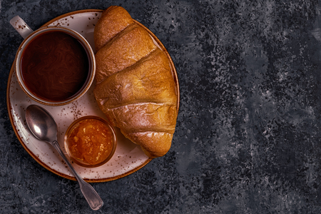 Fresh croissant on dark background. Top view, copy space.の写真素材