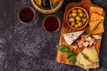 Cheese cracker olives wine. Top view with copy space.の写真素材