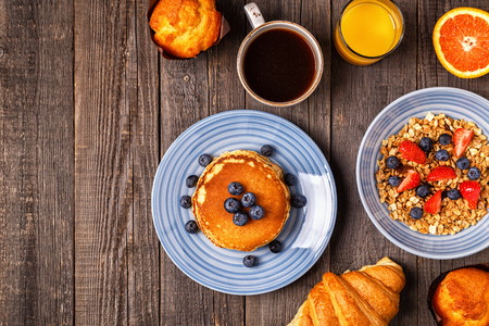 Delicious breakfast on a rustic table. Top view, copy space.の写真素材