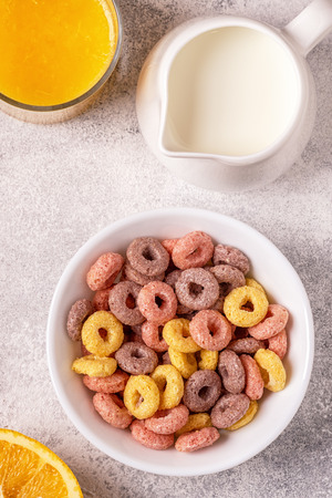Colorful cereal rings in bowl. Top view.