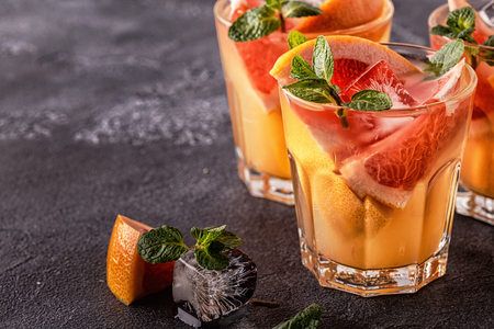 Grapefruit homemade cocktail/detox fruit infused water, selective focus.の写真素材