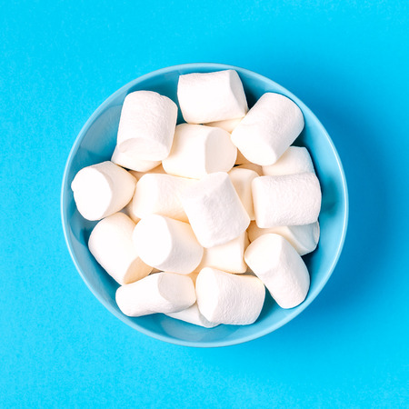White marshmallows for roasting and hot chocolate in a bowl, copy spaceの写真素材