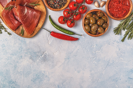 Spanish tapas with  chorizo,  jamon, picnic table, top view.の写真素材