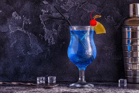 Blue Curacao cocktail decorated with fruit, selective focus.の写真素材