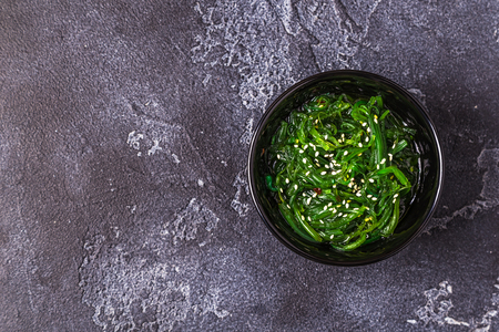 Chuka Seaweed Salad  over black background, copy space, top view.の写真素材