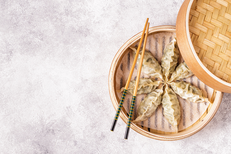 Asian dumplings, soy sauce, chopsticks. Top view, copy space.の写真素材