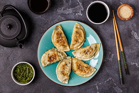 Gyoza or dumplings snack with soy sauce, top view.の写真素材