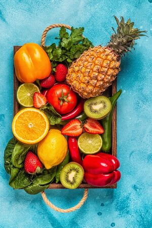 Fruits and vegetables rich in vitamin C in box. Healthy eating. Top viewの写真素材
