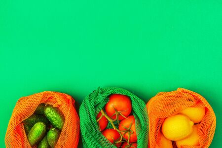 Fresh fruits and vegetables in reusable textile mesh bags, eco friendly shopping, zero waste concept.の写真素材