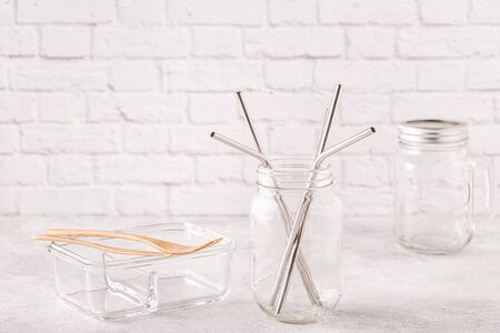 Reusable metal drinking sraws and cleaning brush in a jar. Zero waste concept.の写真素材