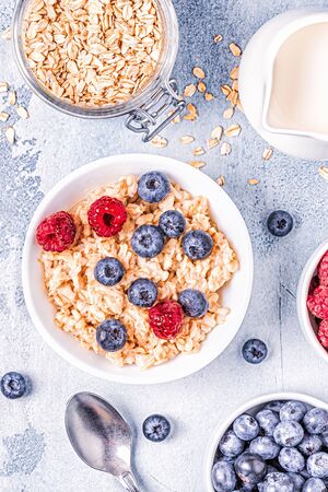 Breakfast, oatmeal with berries, top view.の写真素材