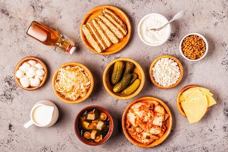 Fermented food, probiotics - kefir, kombucha, sauerkraut, pickles, miso soup, tempeh, natto, kimchi, yogurt, mozzarella and gouda cheeses, cottage cheese.の写真素材