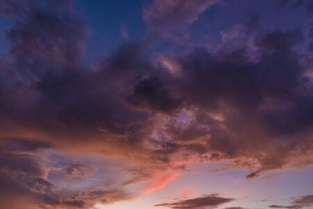 Beautiful evening sky with clouds, sunset, abstract blurred background.の写真素材