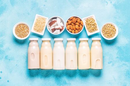 A bottles of alternative  milk and ingredients, top view.の写真素材